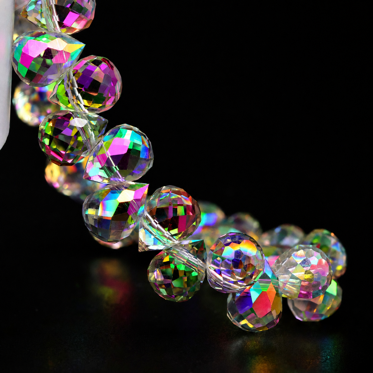 Sunlit Pink faceted teardrop K9 glass bead strand