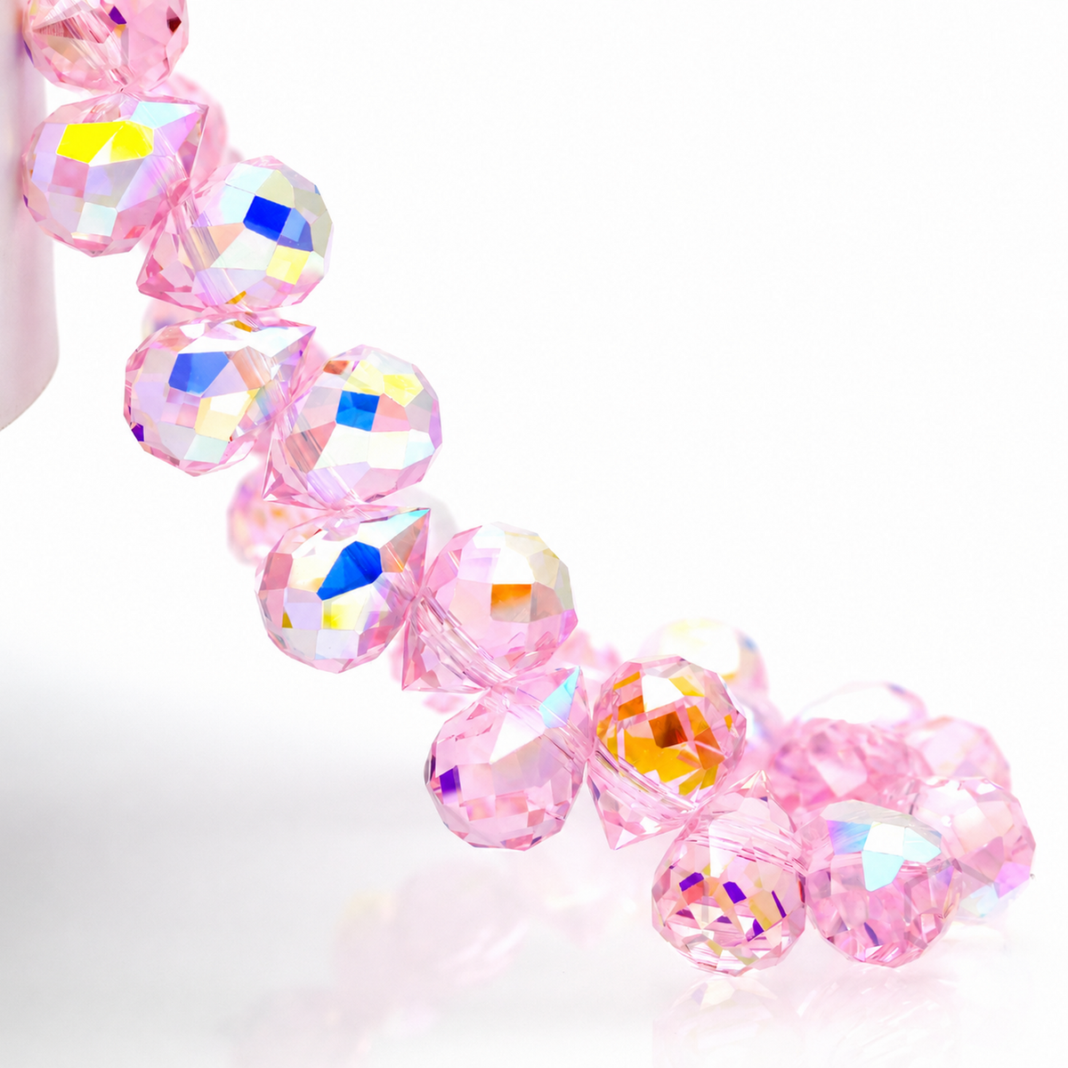 Pink Aurora AB faceted teardrop K9 glass bead strand