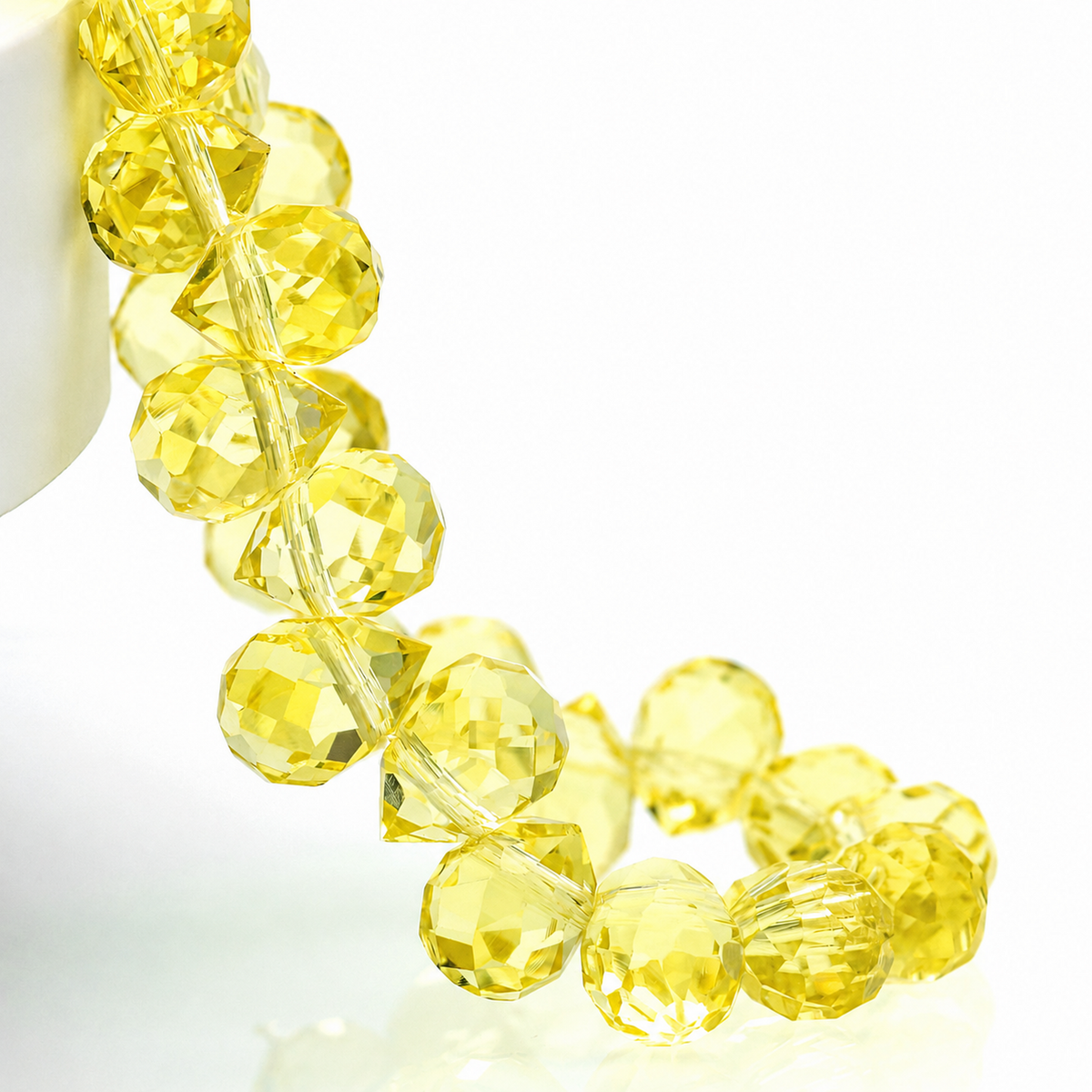 Light Yellow faceted teardrop K9 glass bead strand