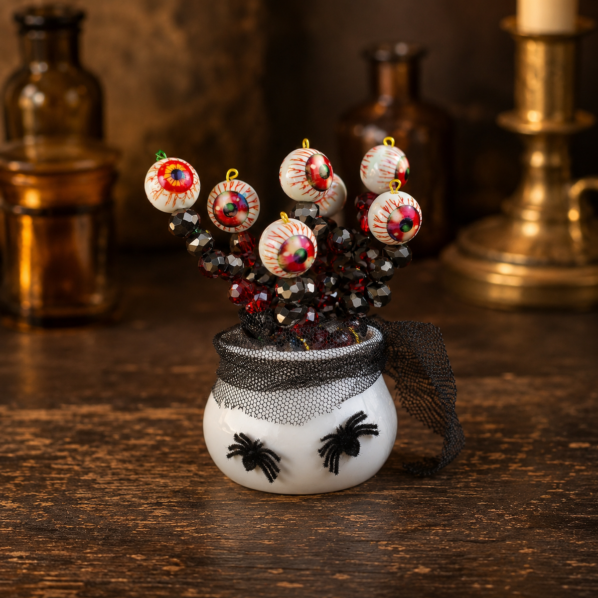 Halloween eyeball beaded plant three-quarter angle on a vintage apothecary table, square product photo