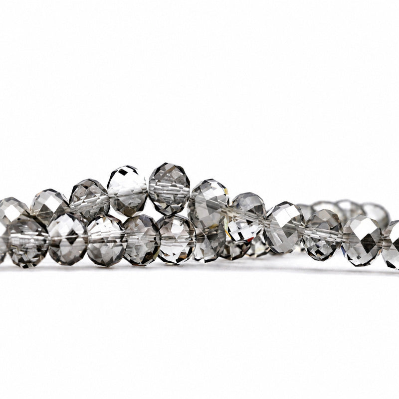 K9 faceted crystal glass rondelle beads in Transparent Gray - sold by the strand