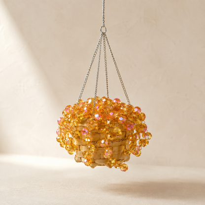 Golden Amber mini beaded plant car charm on a warm neutral background