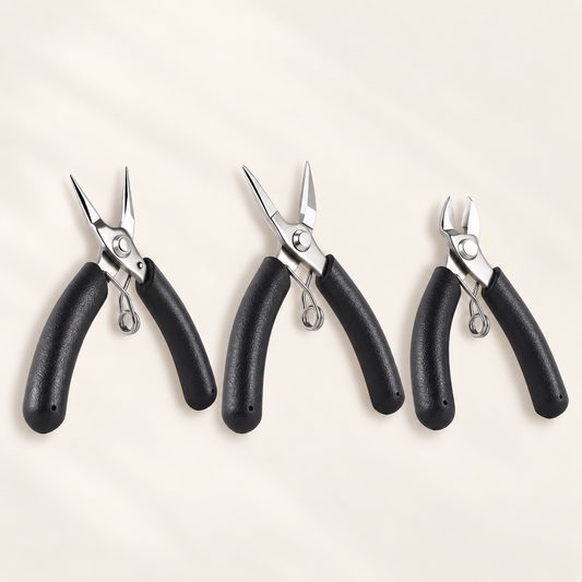 Three mini stainless steel jewelry tools with black handles: round-nose pliers, chain-nose pliers, and diagonal cutters