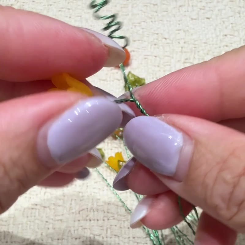 Wire tails being wrapped around the main stem.