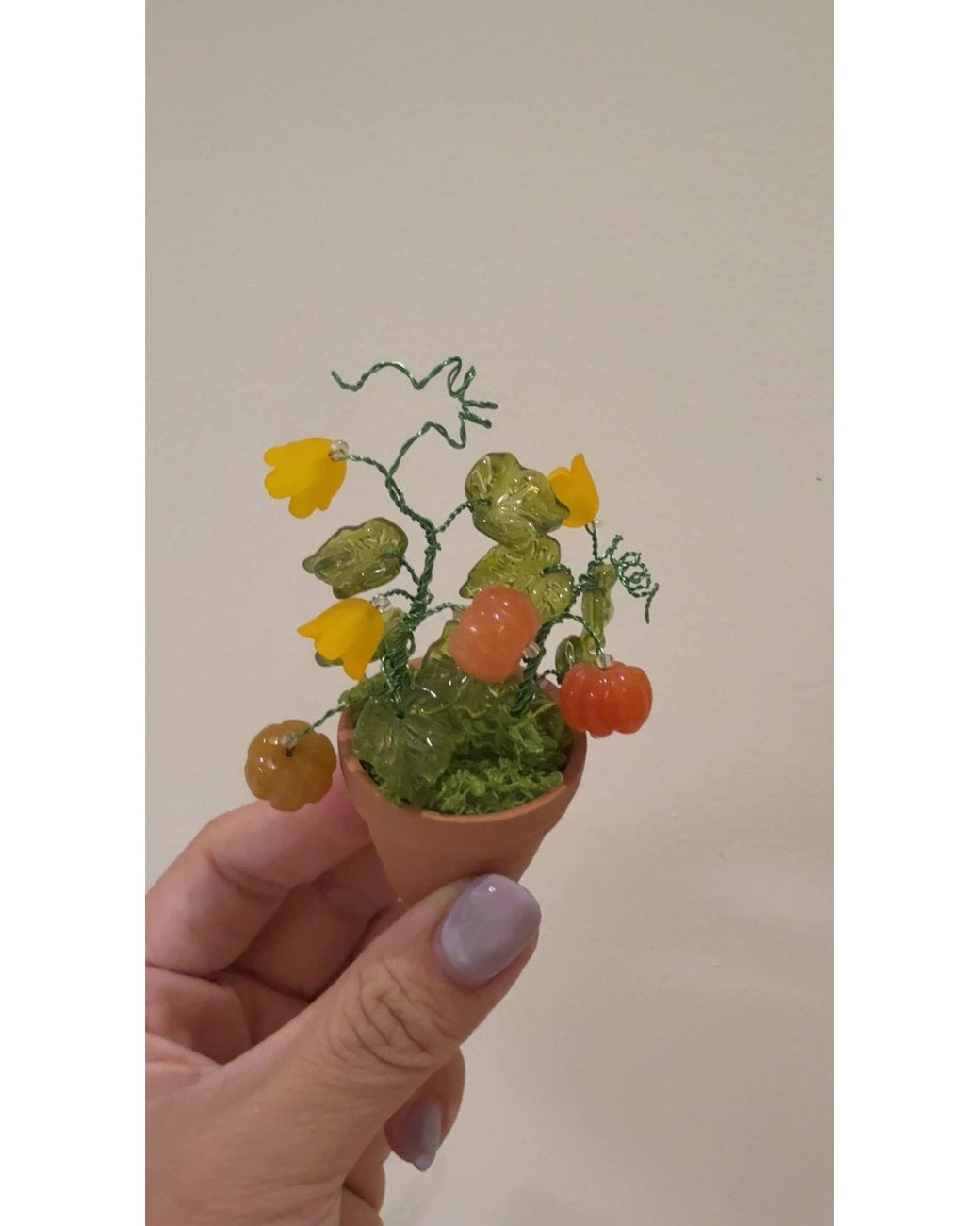 The finished beaded garden held in one hand.