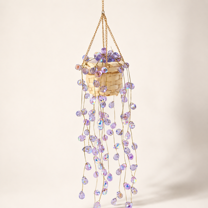Finished purple beaded plant suncatcher sparkling in sunlight