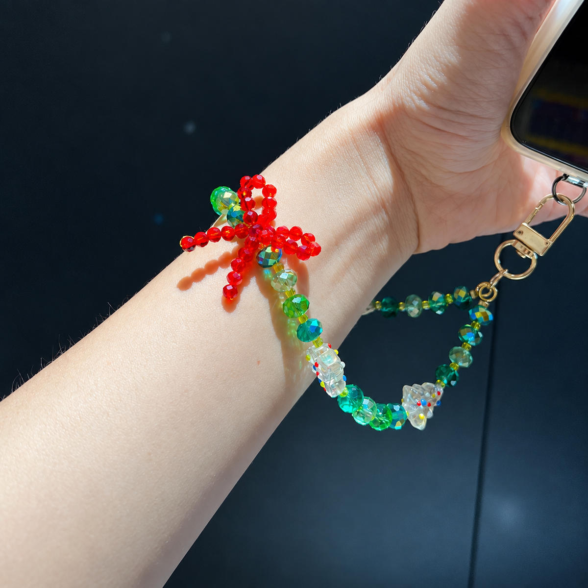 Handmade Christmas bag charm with green and red faceted beads