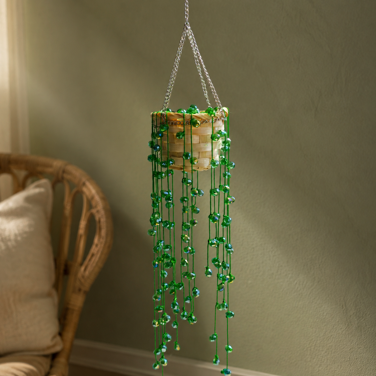 Green beaded String of Pearls hanging plant in a cozy boho room
