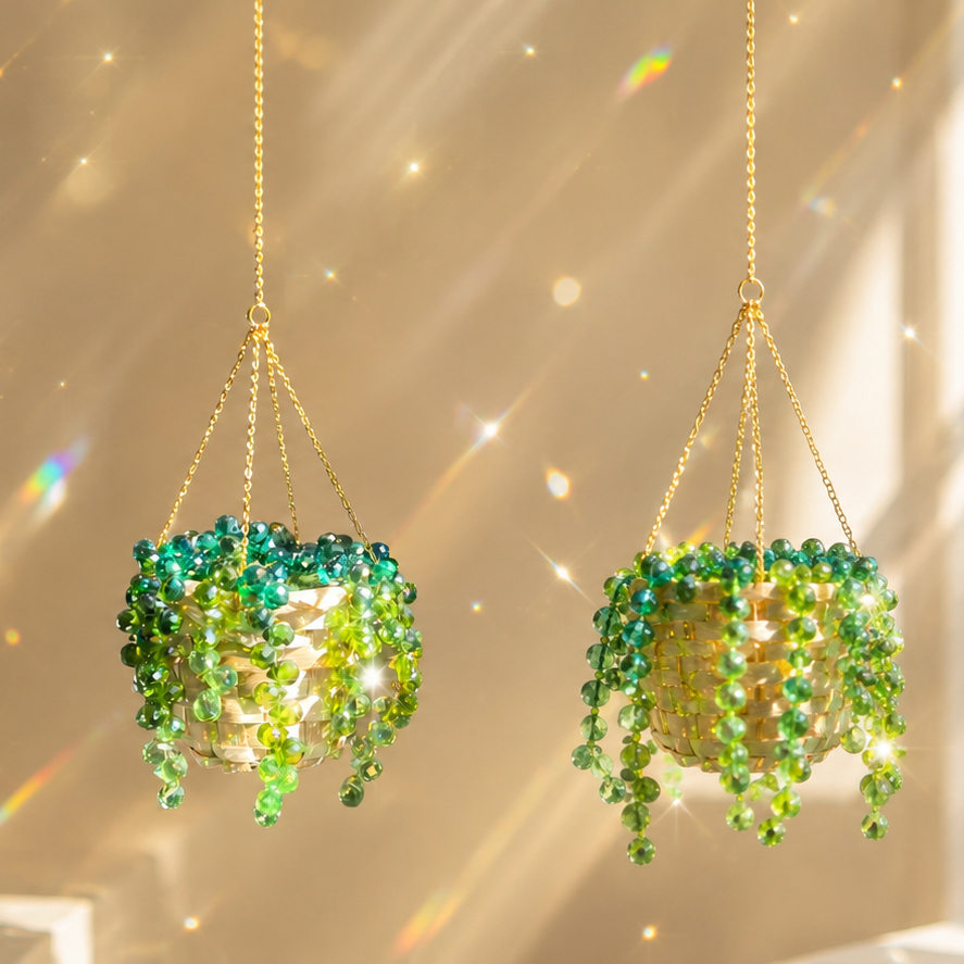 A finished beaded plant suncatcher hanging near a bright window