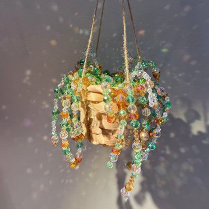 Colorful crystal beaded hanging basket sparkling in sunlight