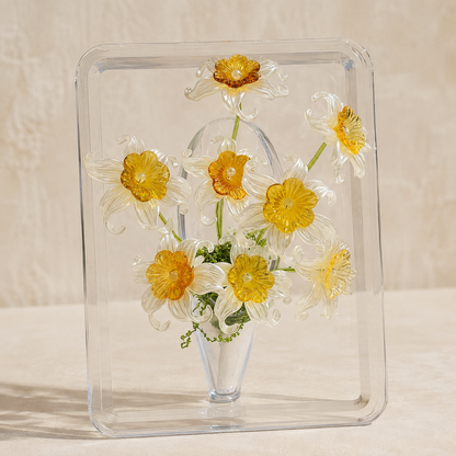 White daffodil beaded flower display in a clear acrylic frame