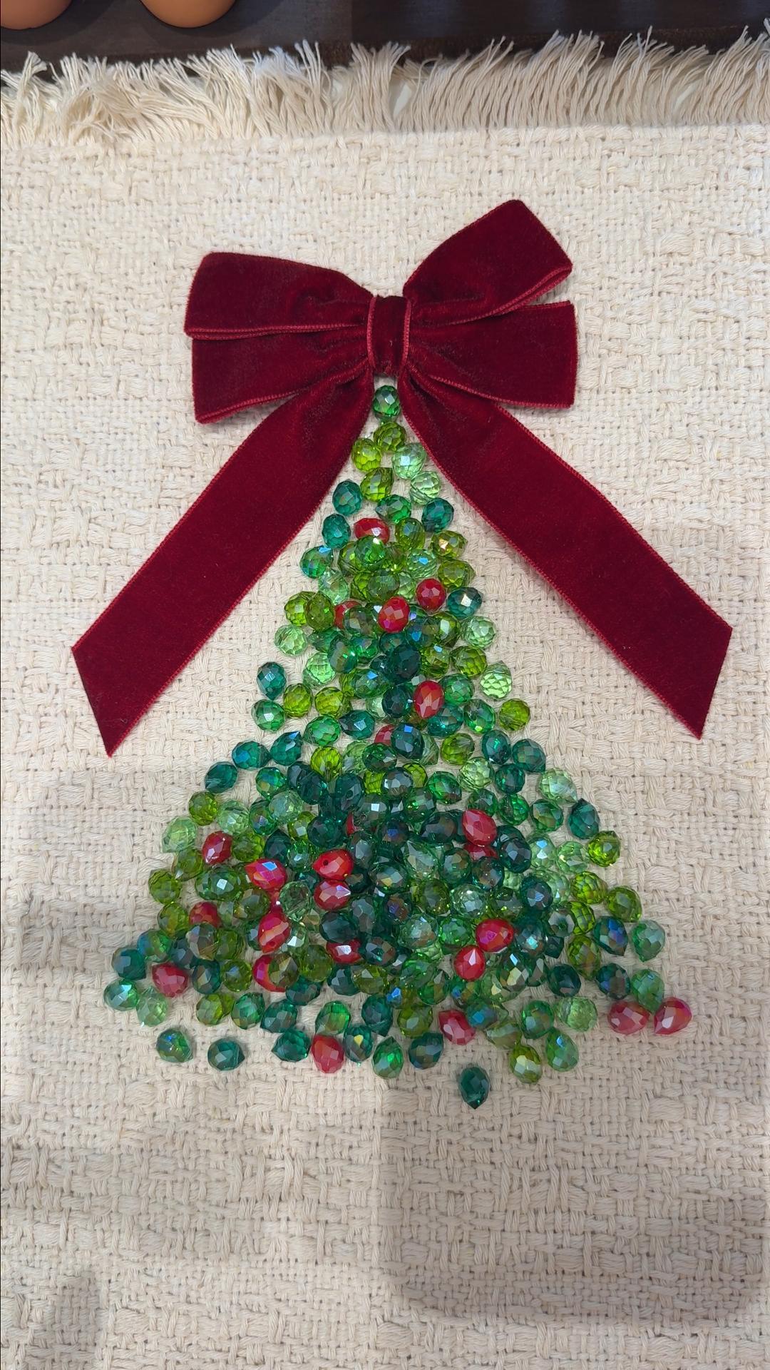 Beaded Christmas tree kit with a red velvet bow, handmade from glass beads